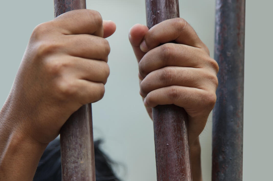 Federal Criminal Defense Support for the Accused in California Two hands tightly gripping rusty prison bars underscore the importance of expert criminal defense investigation support from West Coast Private Investigators in Rancho Santa Margarita, CA.